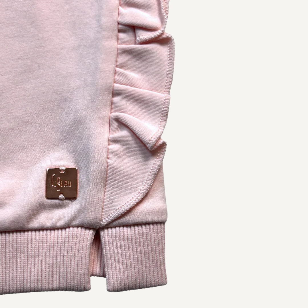 Volantes laterales y tejido rosa suave – Vestido bebé Carrement Beau


